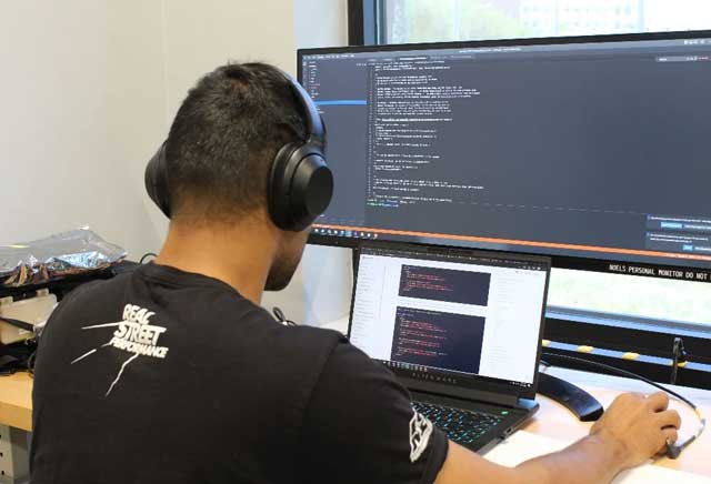 Team member writing code